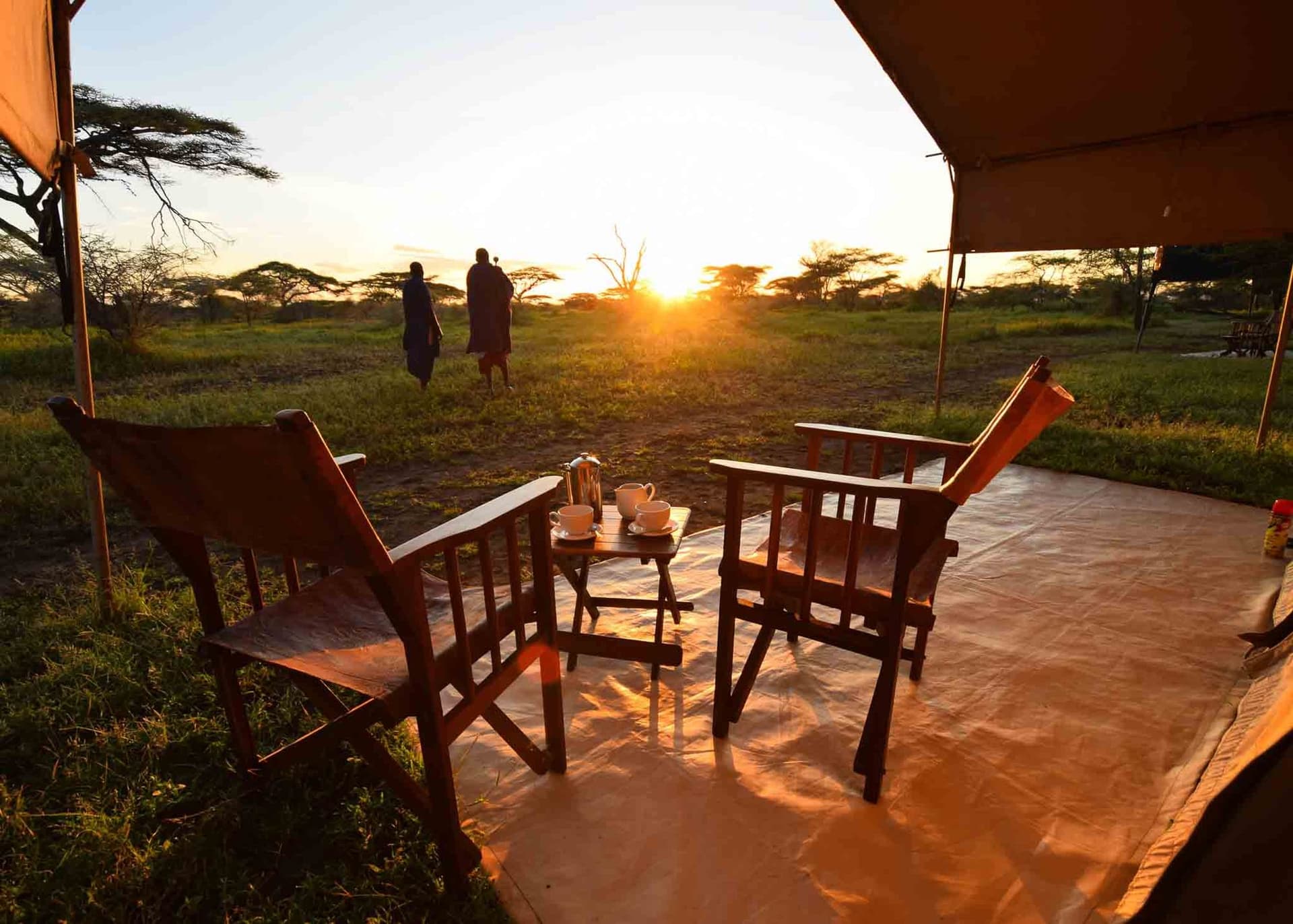 A safari camp and sunset in the Serengeti
