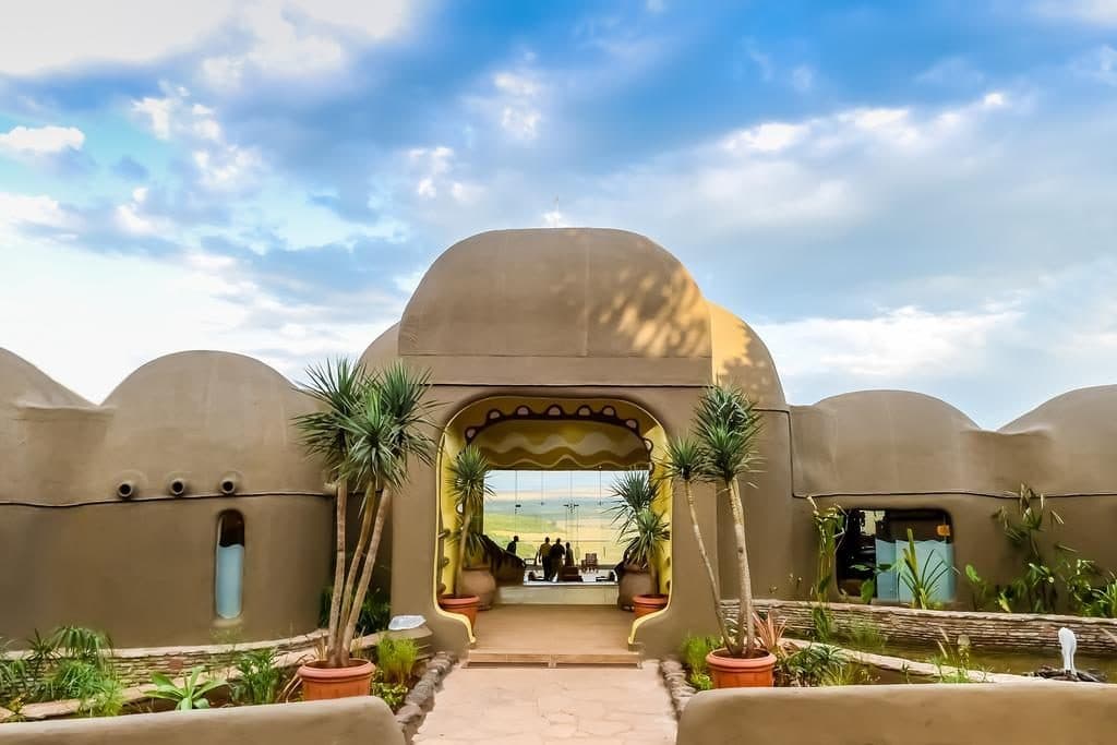 A safari lodge, the entrance and the view in Ngorongoro