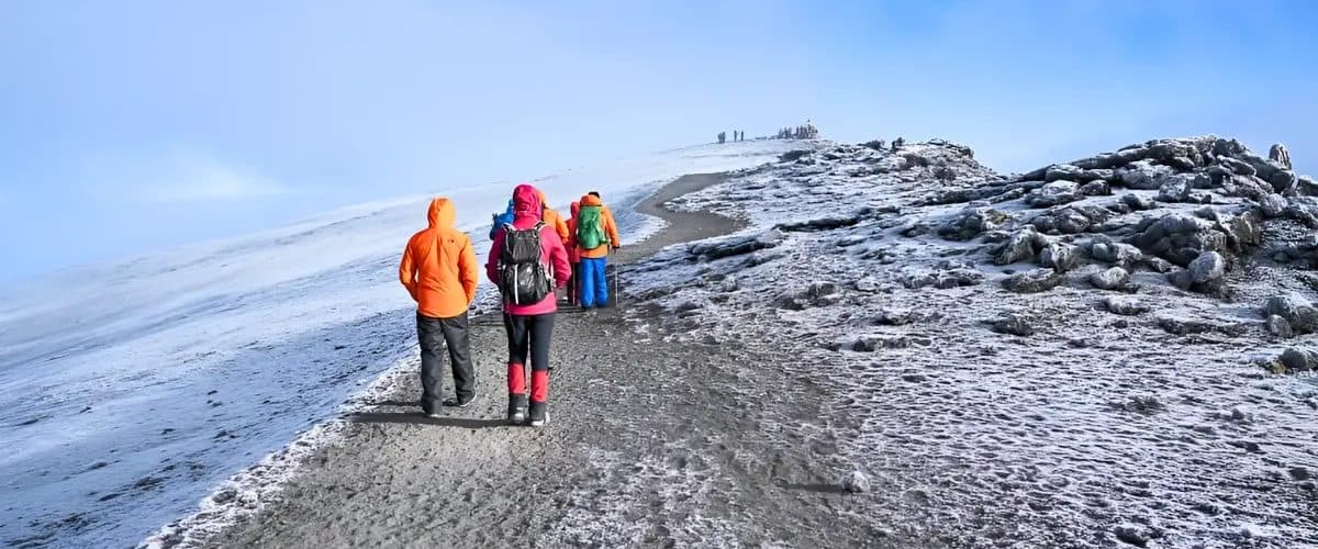 Trekkers and the glacier in Kilimanjaro